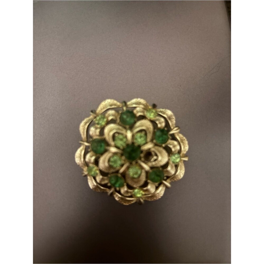Gold-Tone Floral Brooch with Green Crystal Accents